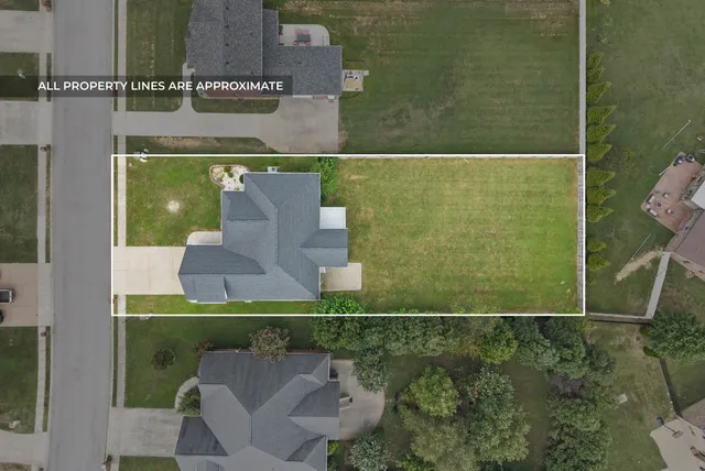 an aerial view of a house with a garden