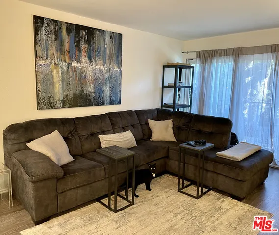 a living room with furniture and window