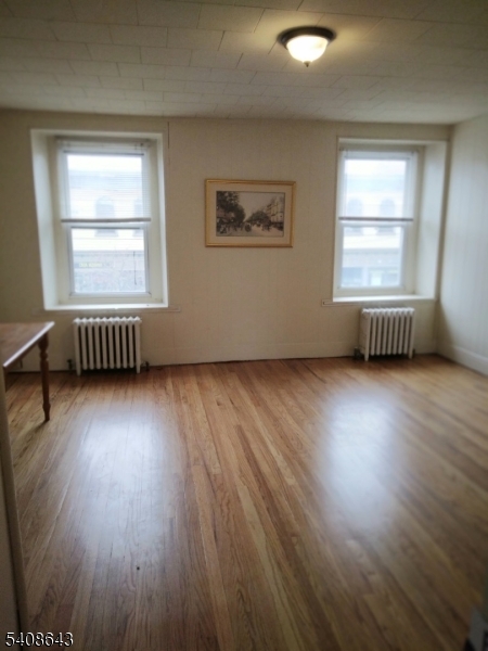 41 Bridge Street Frenchtown, NJ 08825 - Photo 1 of 17 a view of an empty room with wooden floor and a window