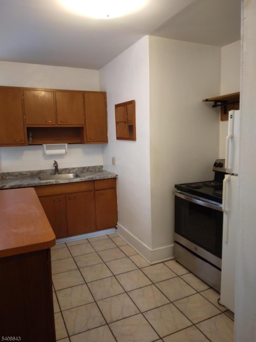 41 Bridge Street Frenchtown, NJ 08825 - Photo 4 of 17 a kitchen with a sink and a stove top oven