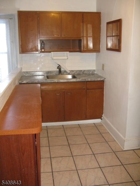 41 Bridge Street Frenchtown, NJ 08825 - Photo 6 of 17 a kitchen with granite countertop a sink and a stove