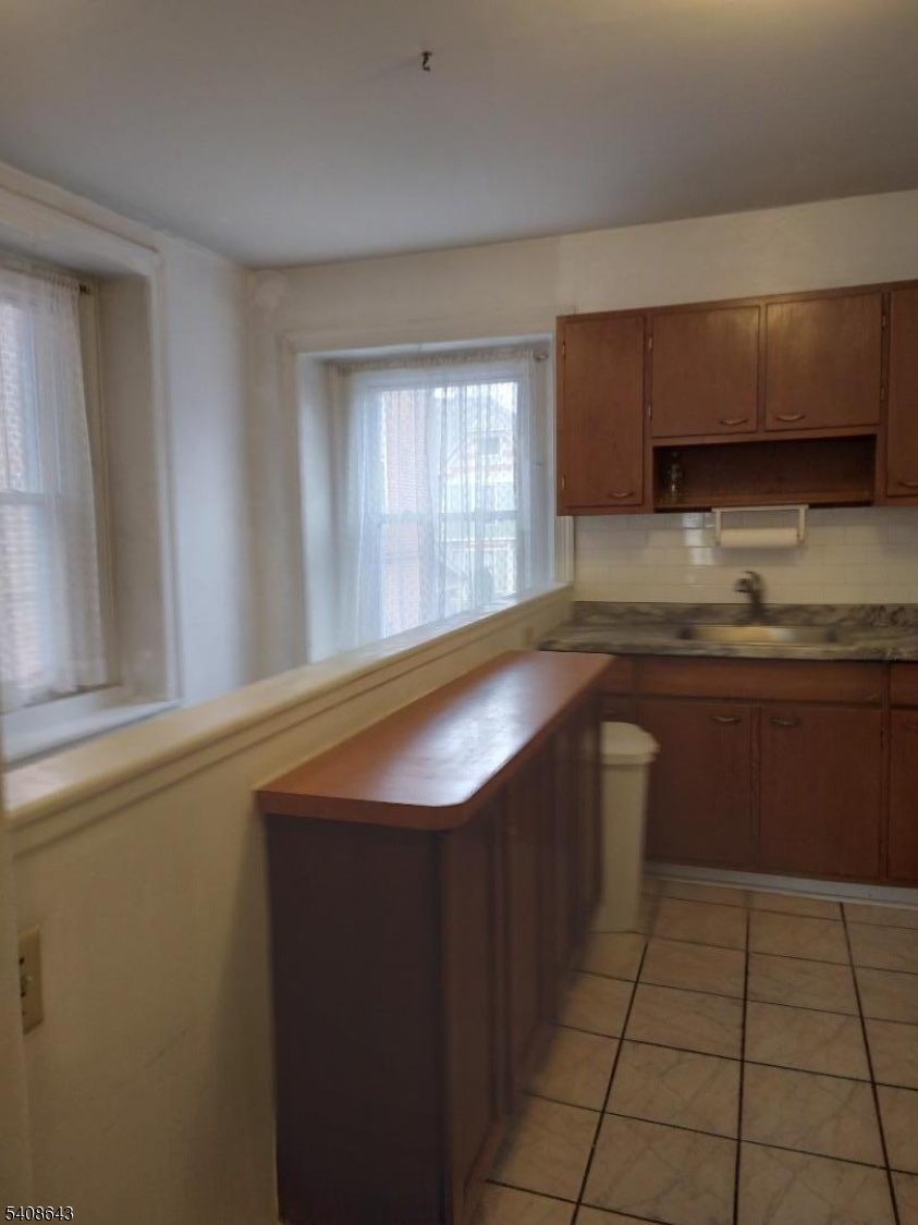 41 Bridge Street Frenchtown, NJ 08825 - Photo 9 of 17 a kitchen with a sink cabinets and a window