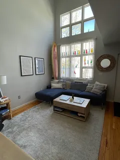 a living room with furniture and a window