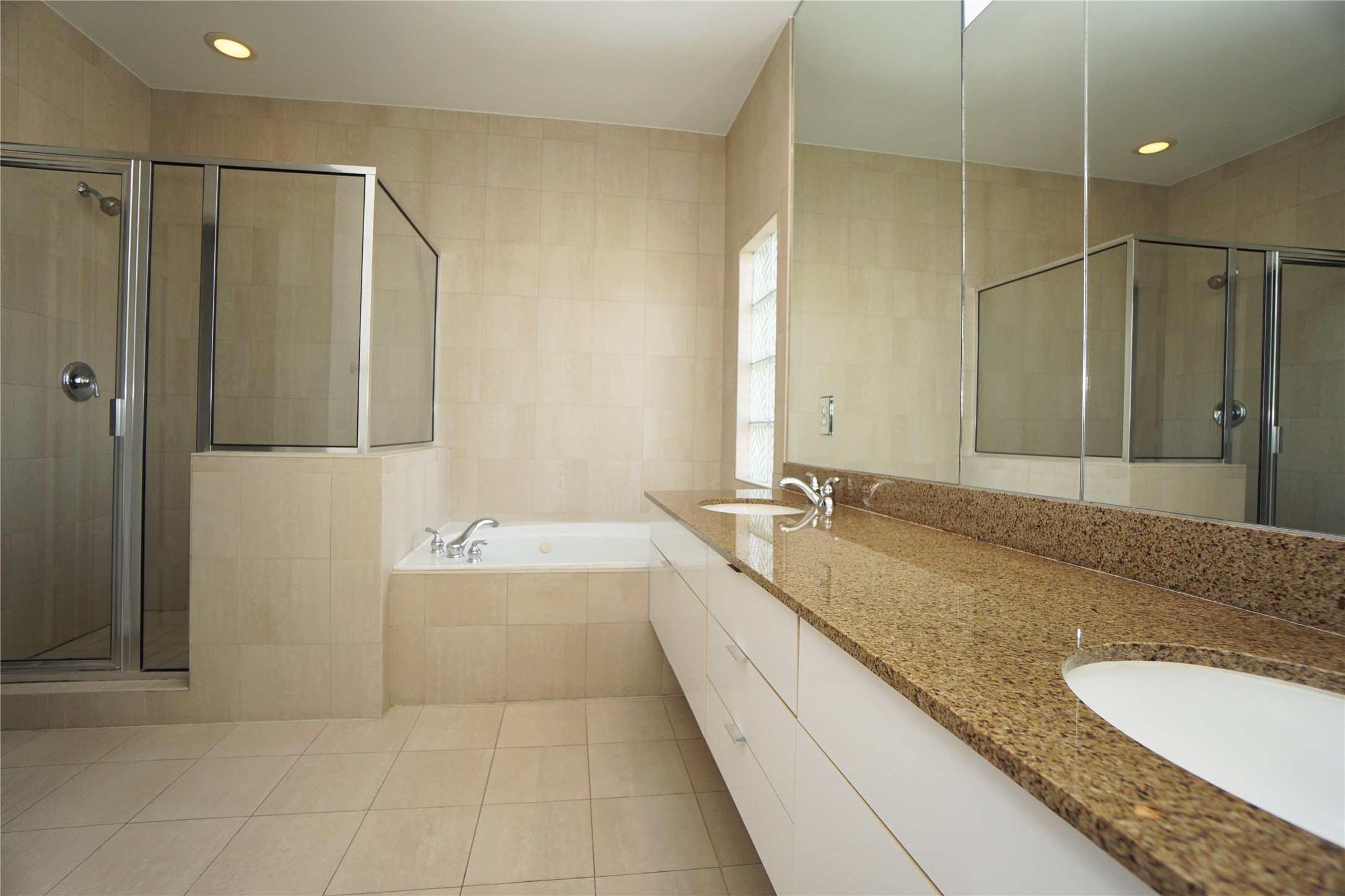 4313 Feagan Street, Unit A Houston, TX 77007 - Photo 14 of 20 a bathroom with a granite countertop double vanity sink and mirror
