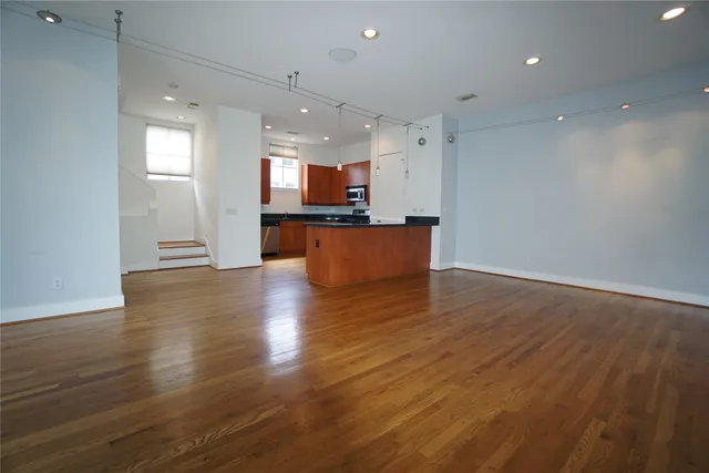 a view of kitchen with sink and microwave