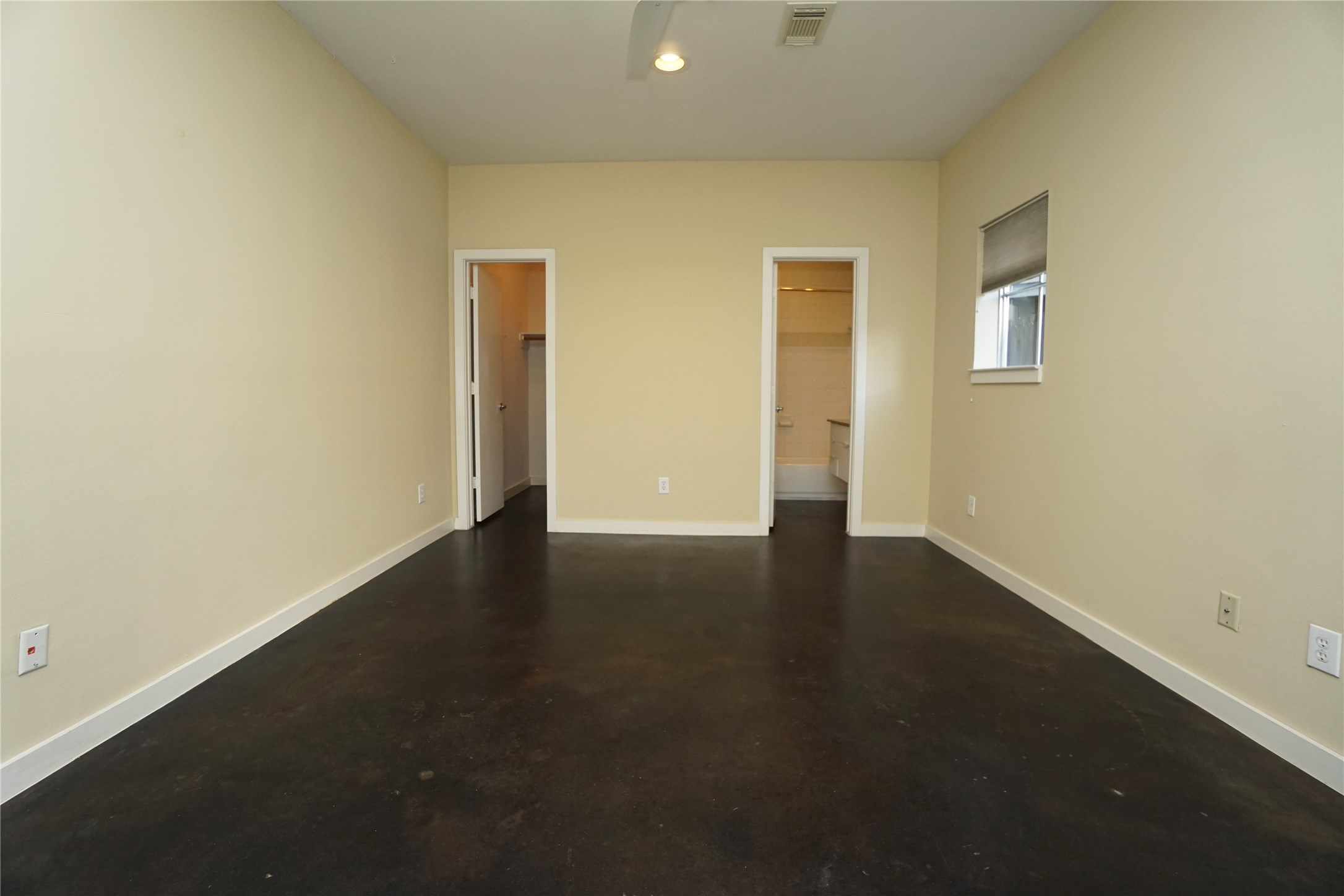 4313 Feagan Street, Unit A Houston, TX 77007 - Photo 8 of 20 an empty room with wooden floor and windows