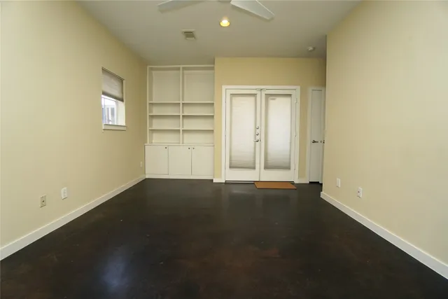 an empty room with closet area
