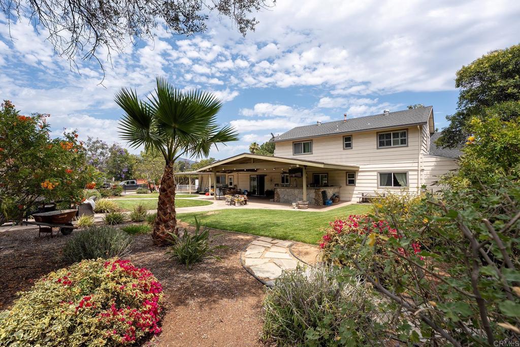2430 Geyer Lane Alpine, CA 91901 - Photo 59 of 60 a front view of a house with a garden and trees