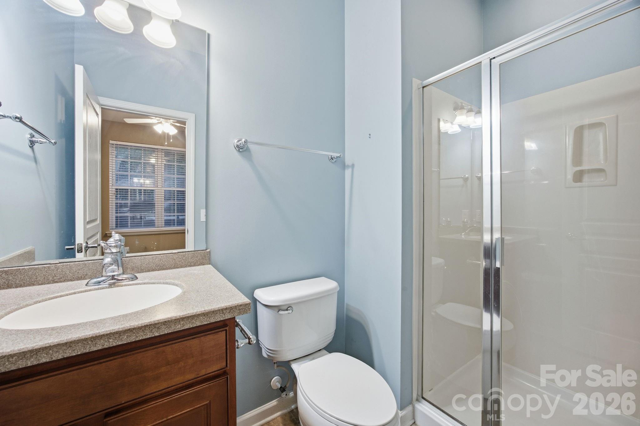 645 6th Baxter Crossing Fort Mill, SC 29708 - Photo 22 of 32 a bathroom with a sink a toilet and shower