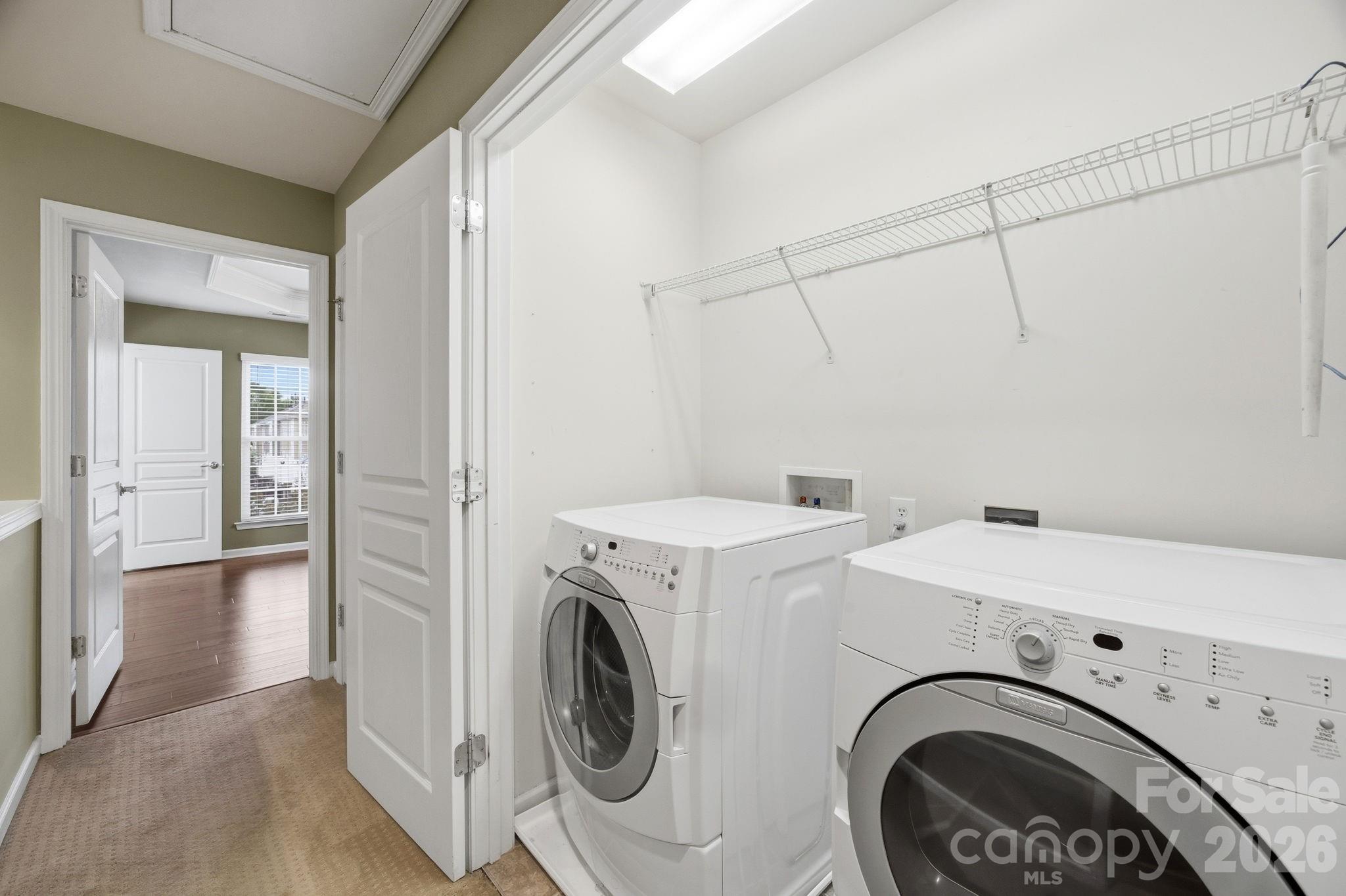 645 6th Baxter Crossing Fort Mill, SC 29708 - Photo 23 of 32 a view of a storage & utility room with dryer and washer
