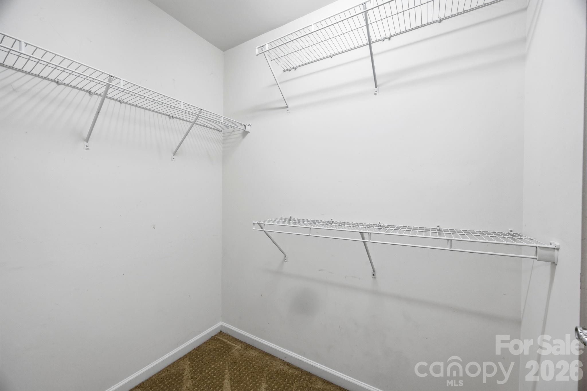 645 6th Baxter Crossing Fort Mill, SC 29708 - Photo 24 of 32 a view of a room with racks on the wall