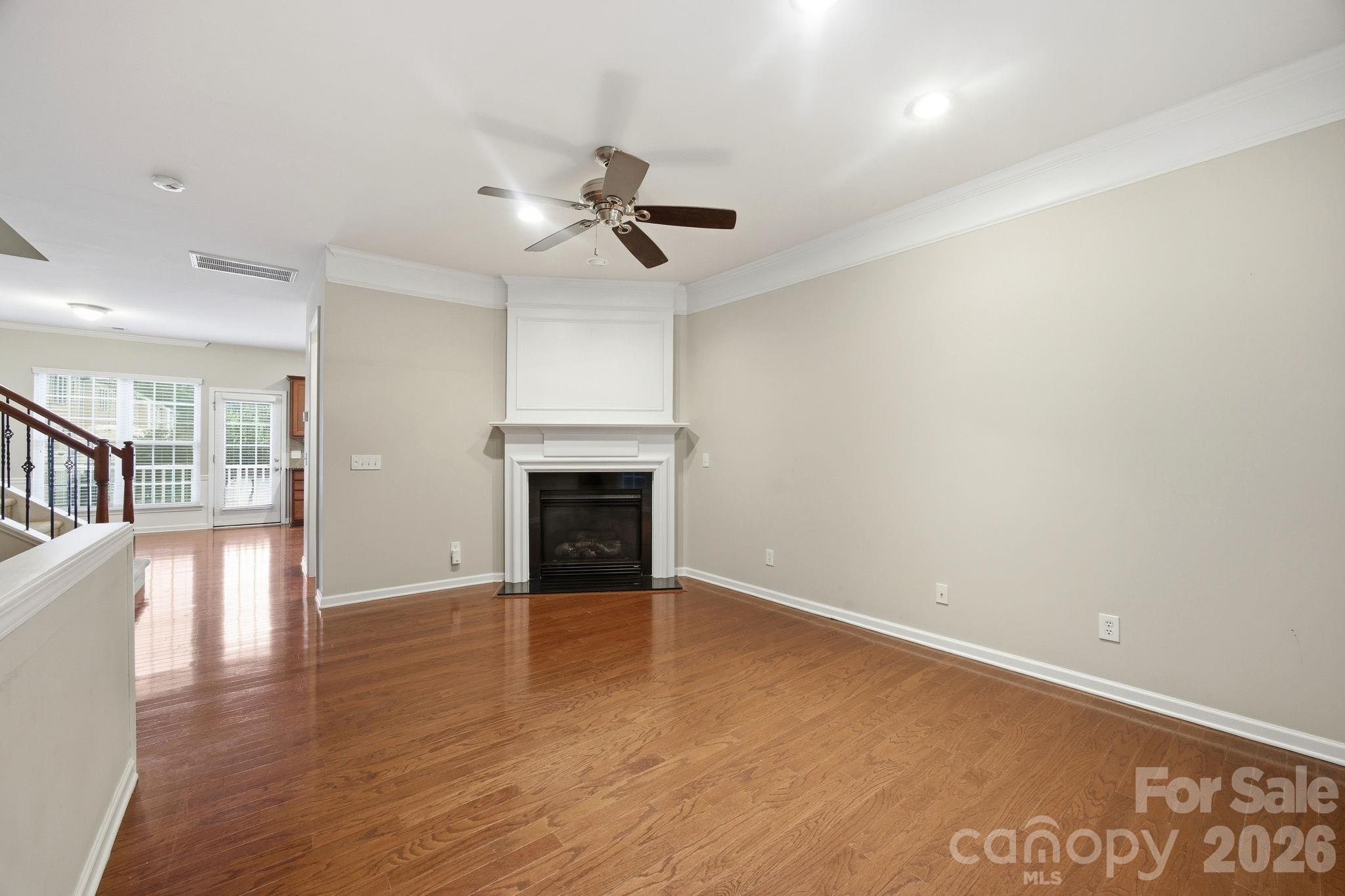 645 6th Baxter Crossing Fort Mill, SC 29708 - Photo 7 of 32 wooden floor in an empty room with a window
