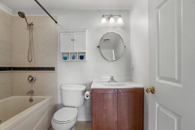 a bathroom with a sink a toilet and bathtub