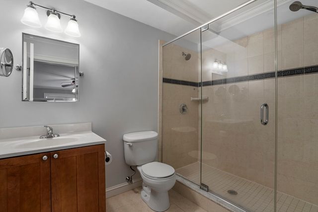 a bathroom with a toilet sink and shower