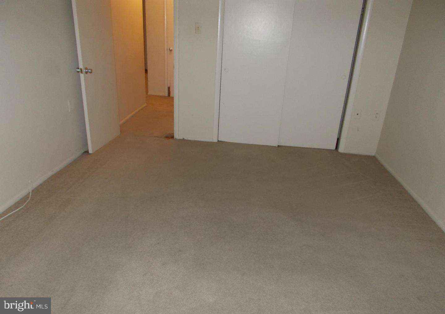 9250 Edwards Way, Unit 207A Hyattsville, MD 20783 - Photo 9 of 11 Bedroom closet/entry view
