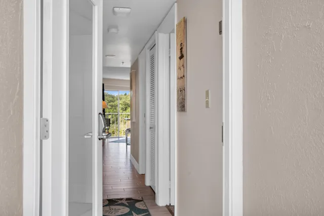 a bedroom with furniture and a large window