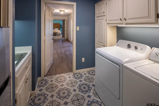 a view of a patio with table and chairs and potted plants