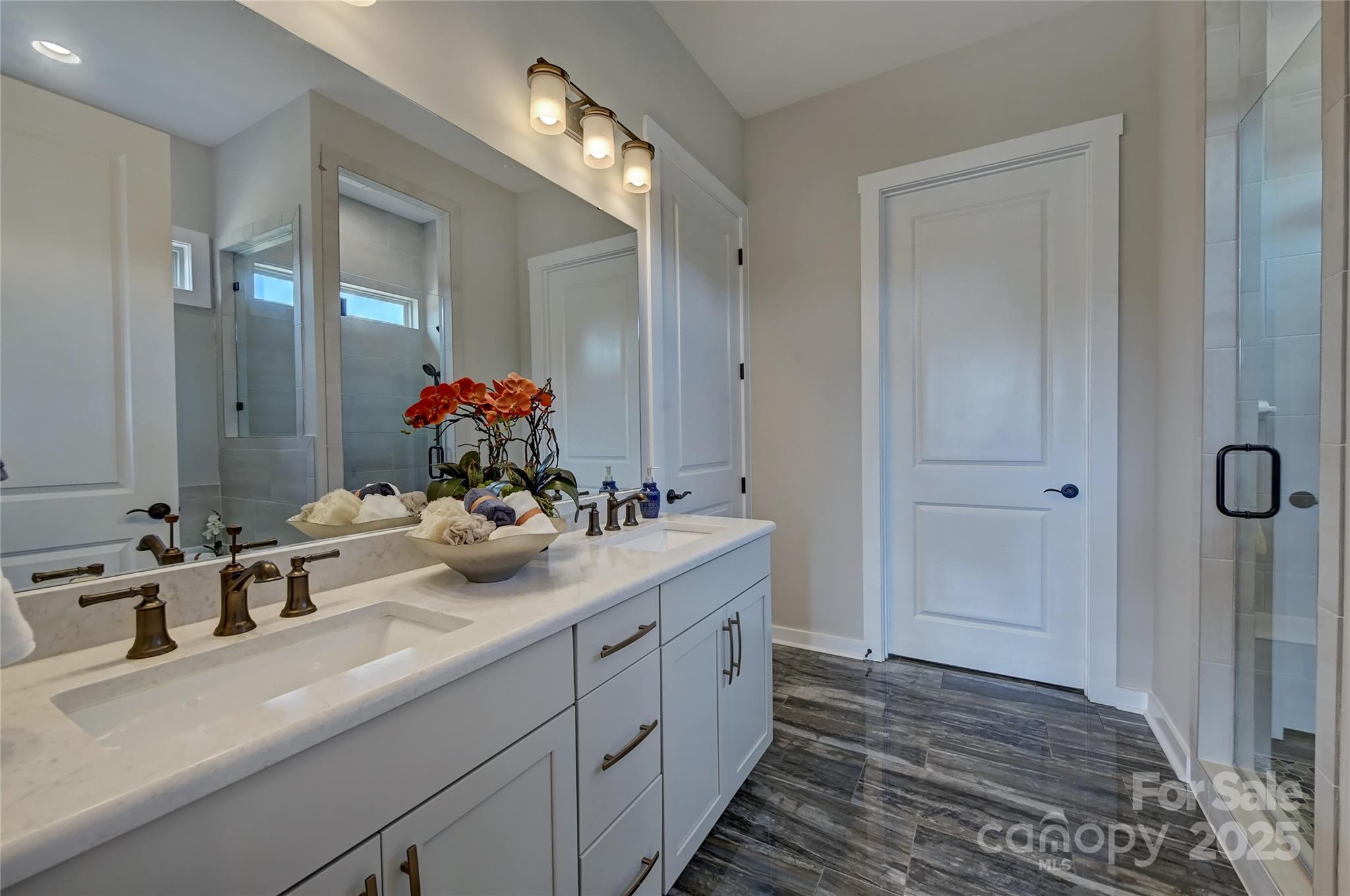 1475 Hubert Graham Way Tega Cay, SC 29708 - Photo 21 of 27 a bathroom with a sink and a mirror