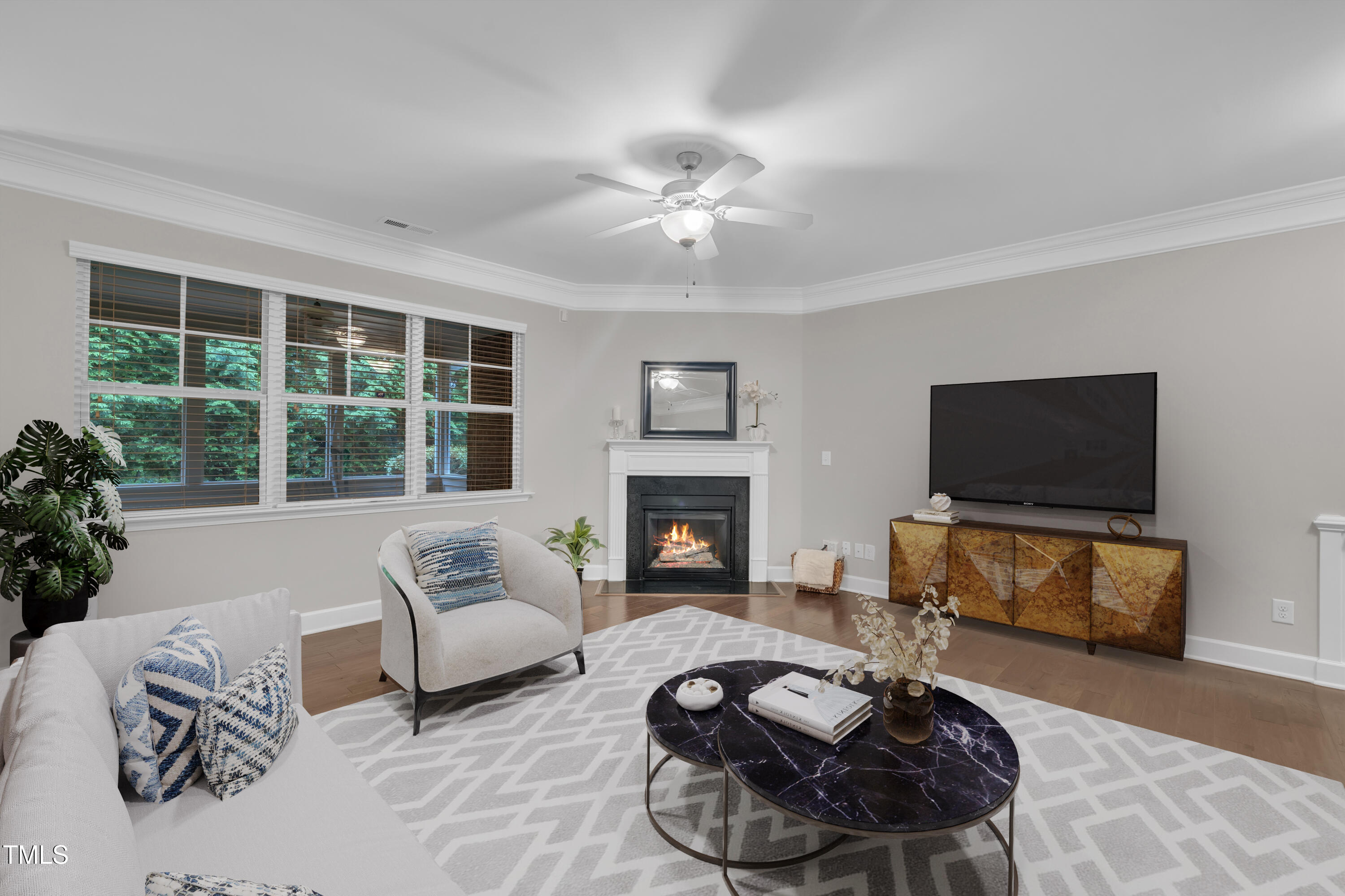 2073 Weston Green Loop Cary, NC 27513 - Photo 11 of 52 a living room with furniture a fireplace and a flat screen tv
