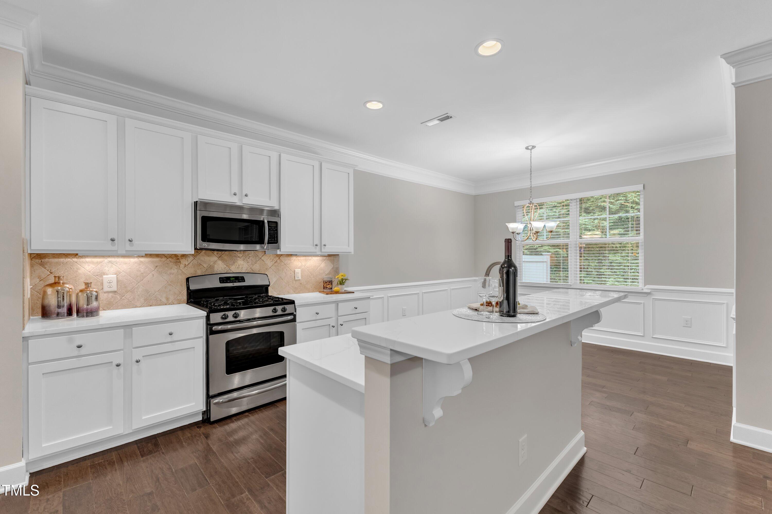 2073 Weston Green Loop Cary, NC 27513 - Photo 21 of 52 a kitchen that has a sink and a stove top oven