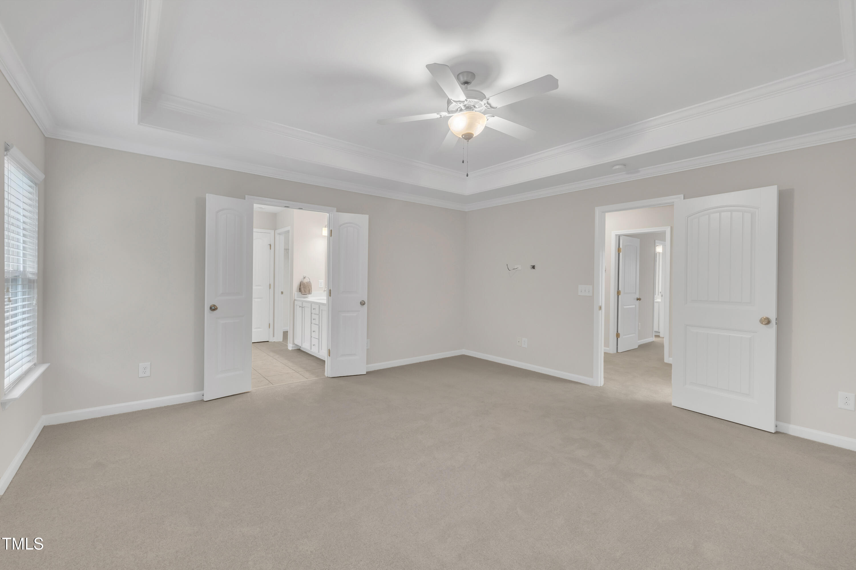 2073 Weston Green Loop Cary, NC 27513 - Photo 30 of 52 a view of an empty room with a chandelier fan