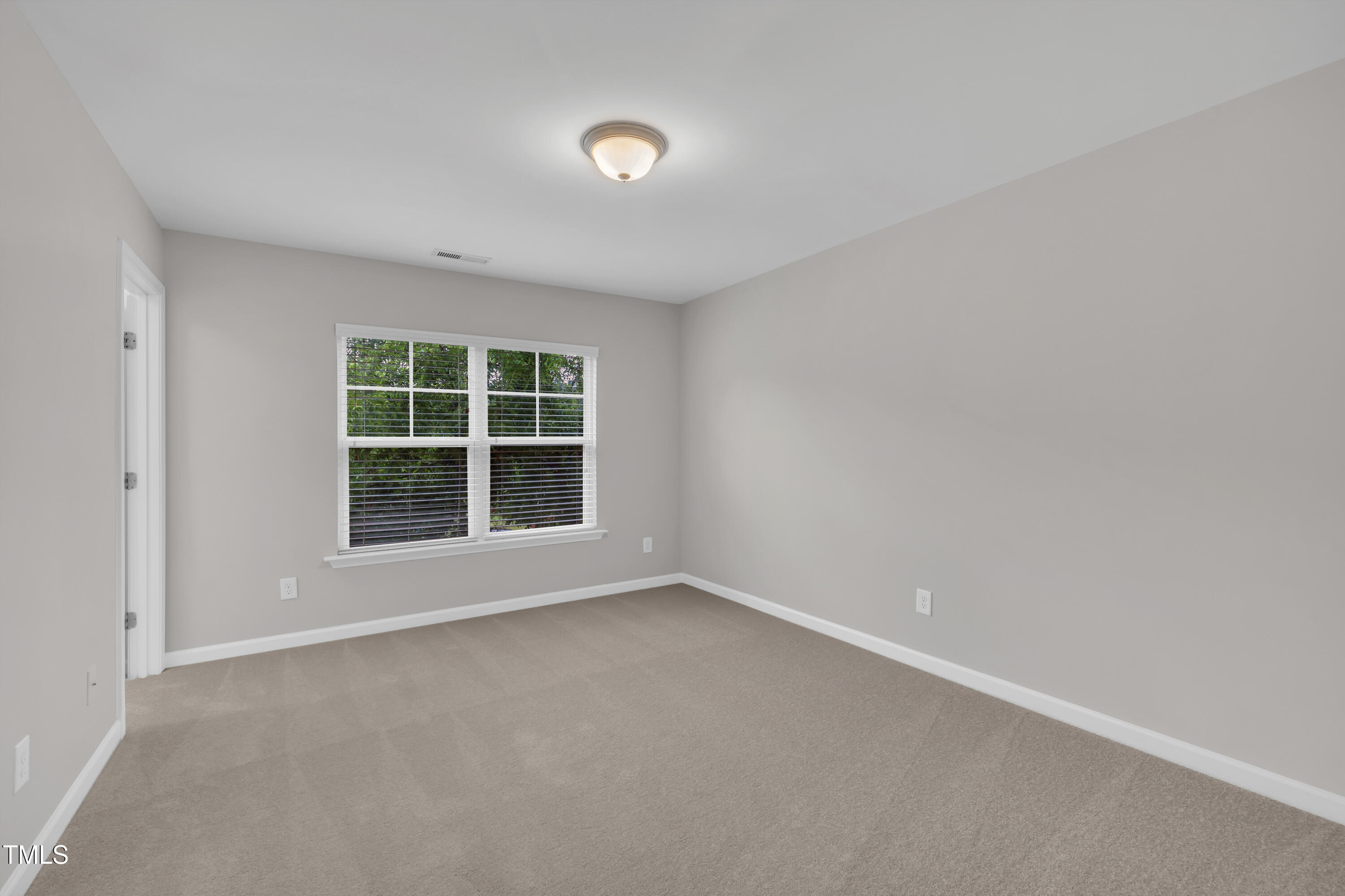 2073 Weston Green Loop Cary, NC 27513 - Photo 36 of 52 an empty room with a window