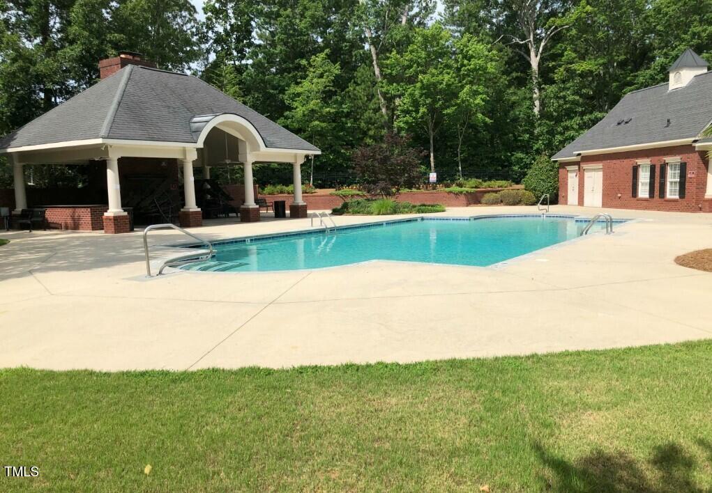 2073 Weston Green Loop Cary, NC 27513 - Photo 46 of 52 a front view of a house with a yard