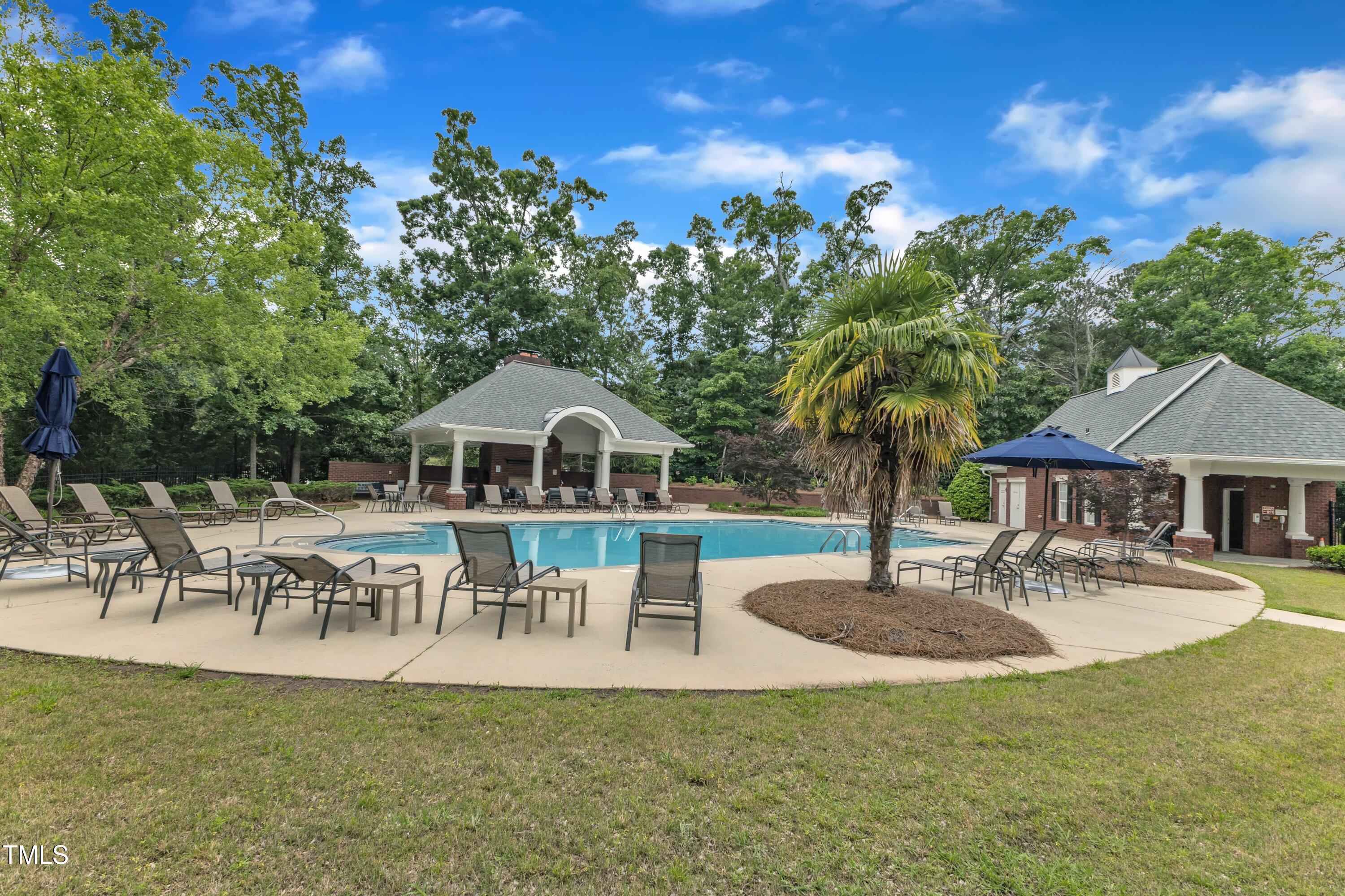2073 Weston Green Loop Cary, NC 27513 - Photo 49 of 52 a view of a house with patio and a yard