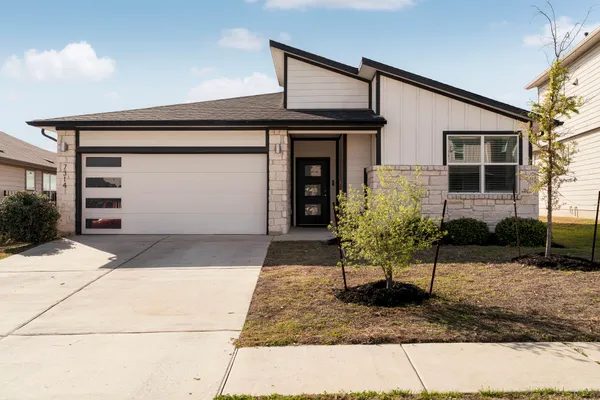 a kitchen with stainless steel appliances granite countertop a refrigerator stove microwave and sink