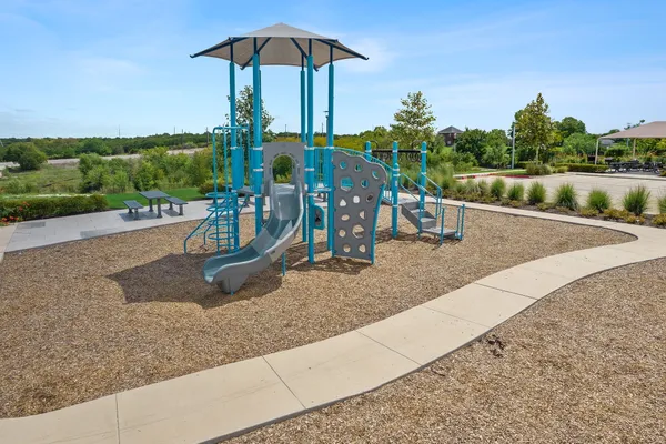 swimming pool view with a seating space