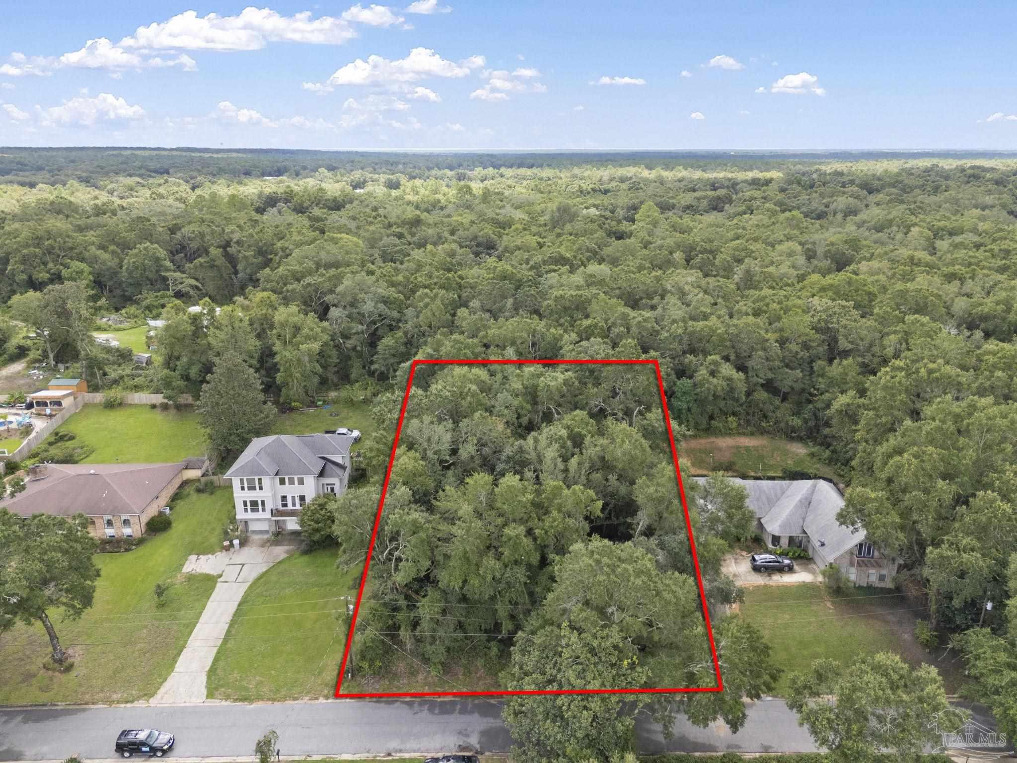 17 Lakeside Drive Milton, FL 32583 - Photo 1 of 7 an aerial view of residential houses with outdoor space and street view