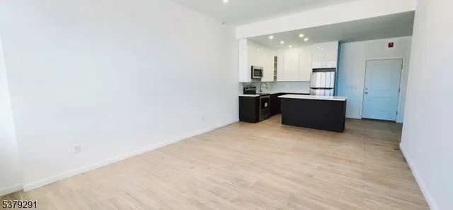a view of kitchen with wooden floor