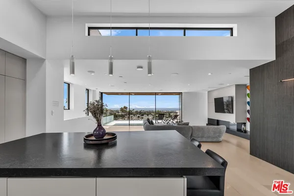 a view of a living room and kitchen