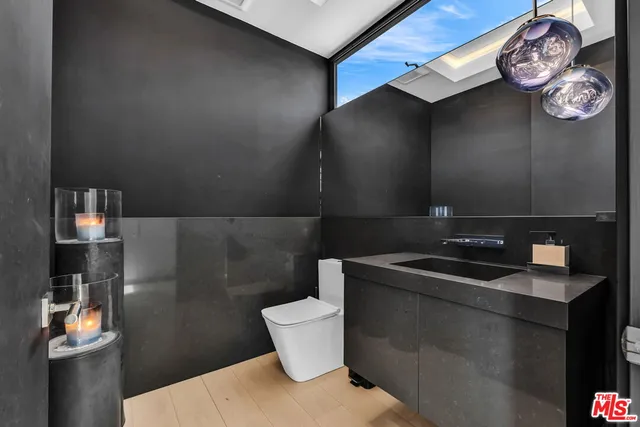 a bathroom with a toilet and a sink