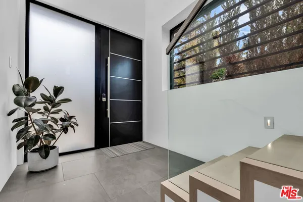 a view of a living room cabinets and a potted plant
