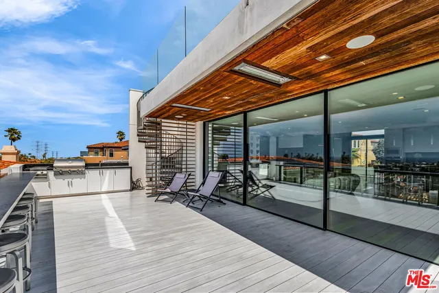 a view of a hall with wooden floor