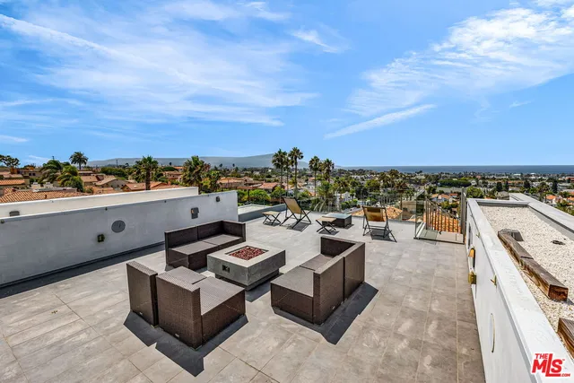 a view of a terrace with furniture