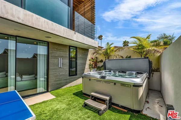 a room with table and outdoor seating