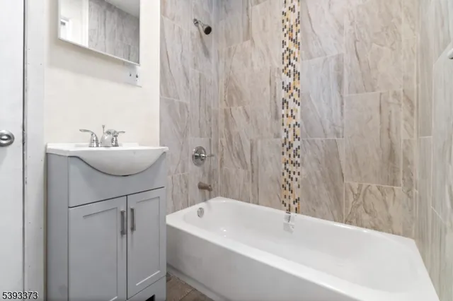 a bathroom with a sink and mirror