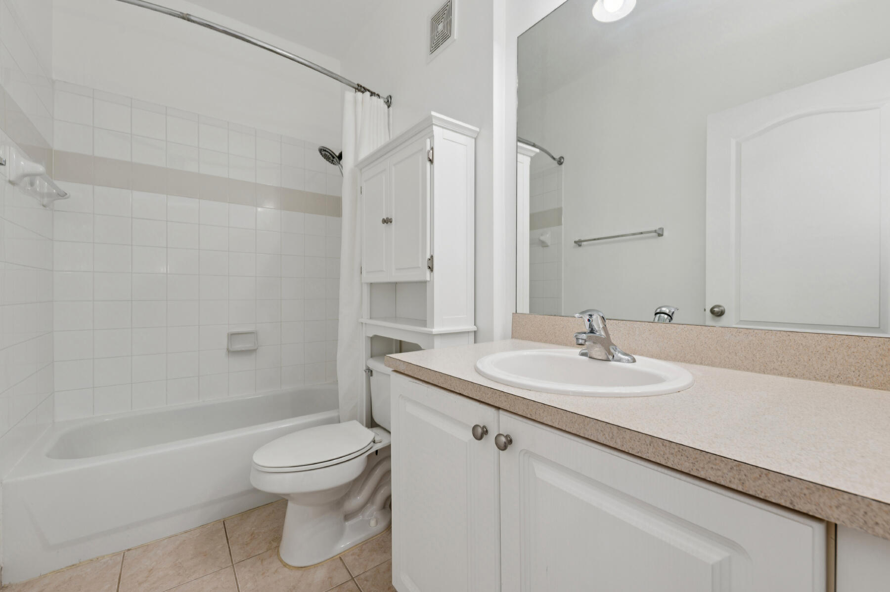 11022 Legacy Drive, Unit 101 Palm Beach Gardens, FL 33410 - Photo 10 of 16 a bathroom with a sink toilet vanity and shower