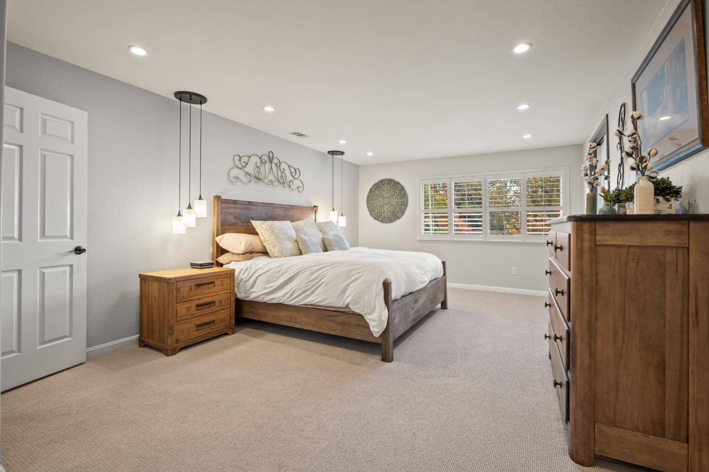 26 Seminole Court San Ramon, CA 94583 - Photo 25 of 51 a bedroom with a large bed and wooden floor