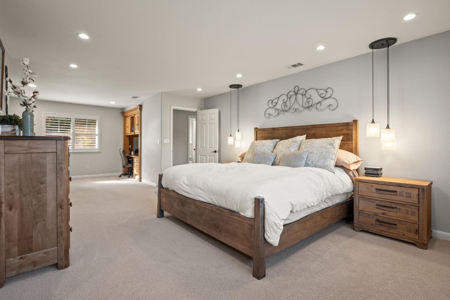 26 Seminole Court San Ramon, CA 94583 - Photo 27 of 51 a spacious bedroom with a bed a dresser and mirror