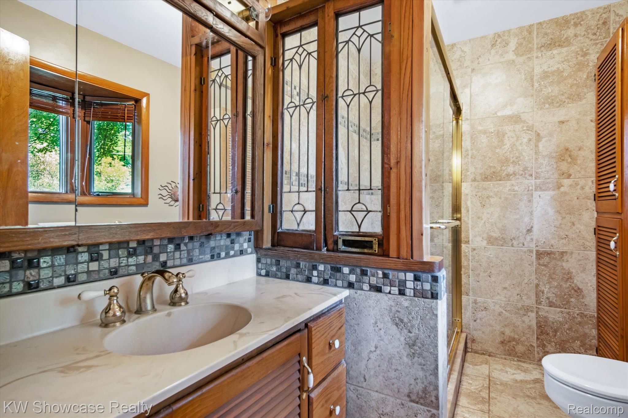 9220 Mcgregor Road Pinckney, MI 48169 - Photo 26 of 40 The Bathroom has charm & character.