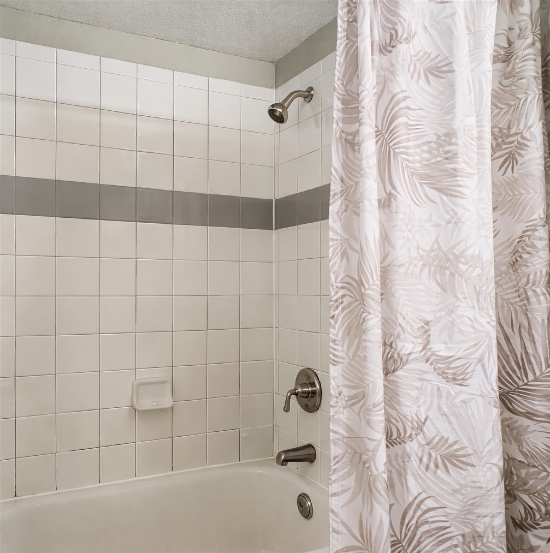 2502 Leon Street, Unit 100 Austin, TX 78705 - Photo 11 of 23 a bathroom with a bathtub and shower