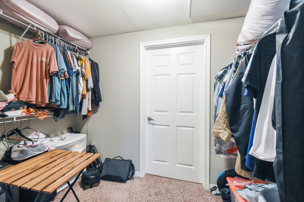 2502 Leon Street, Unit 100 Austin, TX 78705 - Photo 12 of 17 a view of walk in closet with clothes and shoes