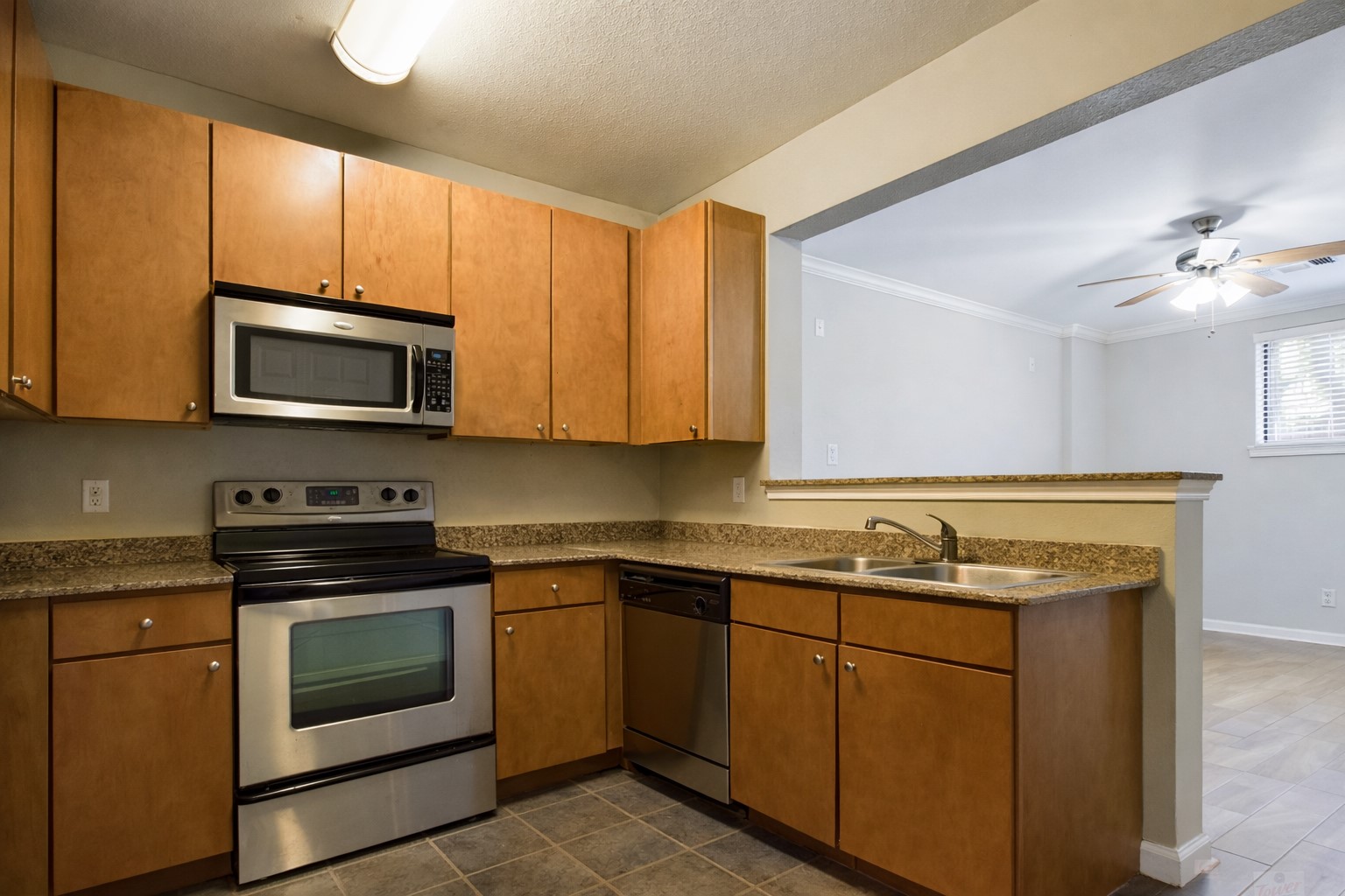 2502 Leon Street, Unit 100 Austin, TX 78705 - Photo 4 of 23 a kitchen with a sink stove and microwave