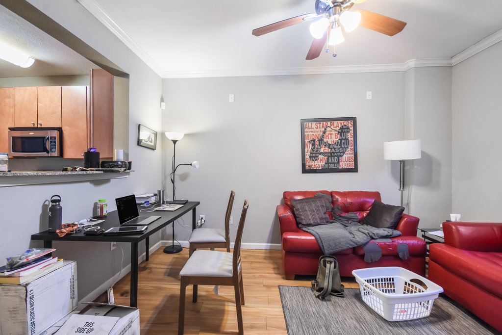 2502 Leon Street, Unit 100 Austin, TX 78705 - Photo 9 of 17 a living room with furniture and a wooden floor