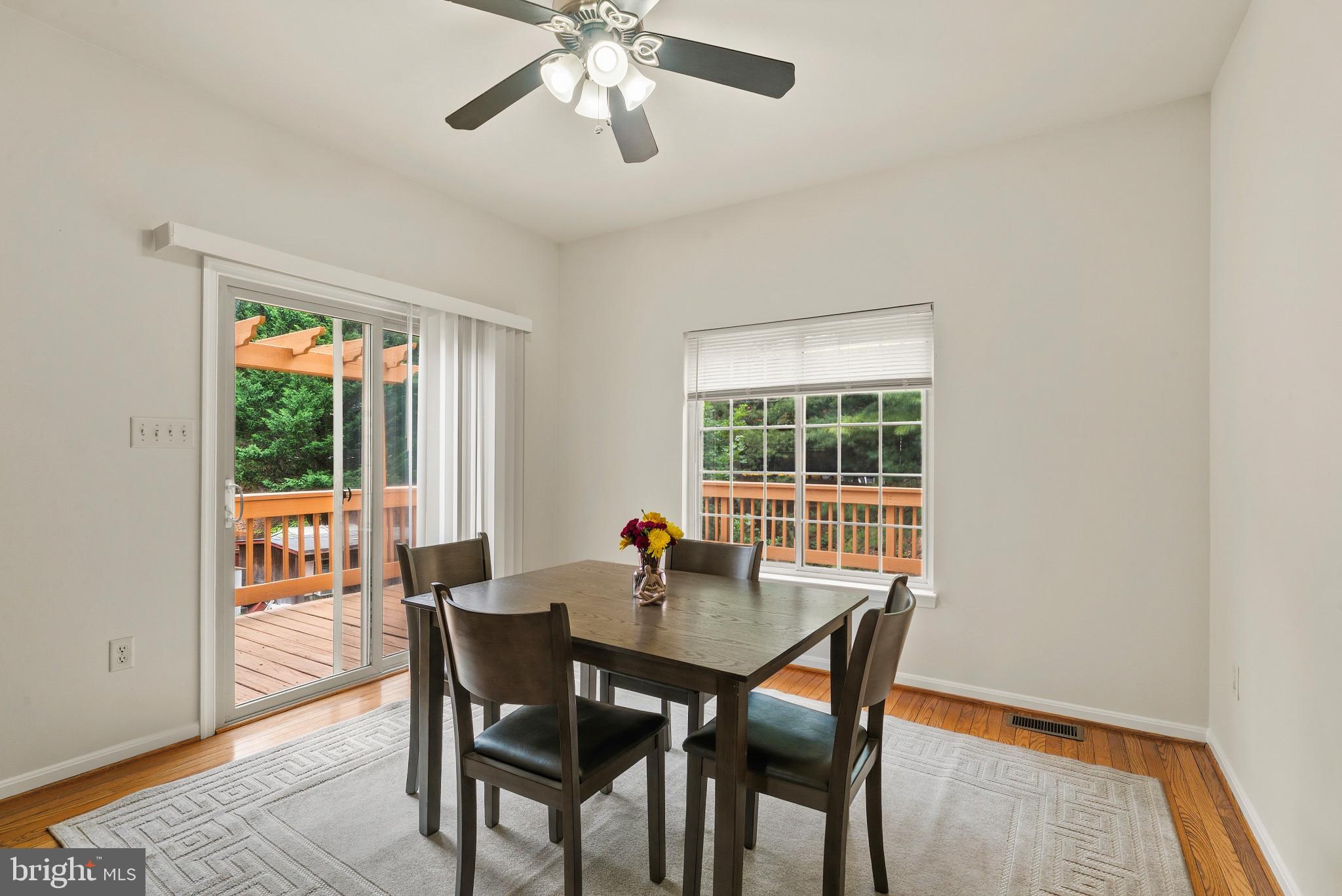 1709 Woodruff Way Frederick, MD 21701 - Photo 16 of 42 a dining room with furniture window and wooden floor