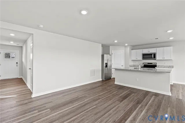 a view of kitchen with wooden floor