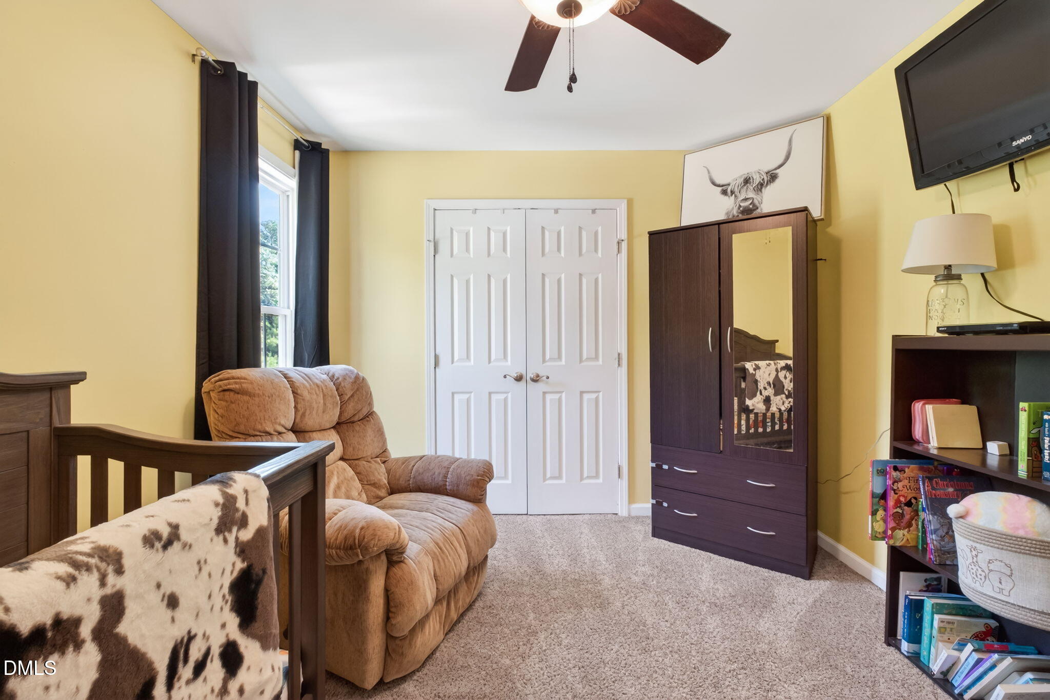923 White Memorial Church Road Willow Spring, NC 27592 - Photo 30 of 46 a living room with furniture and a flat screen tv